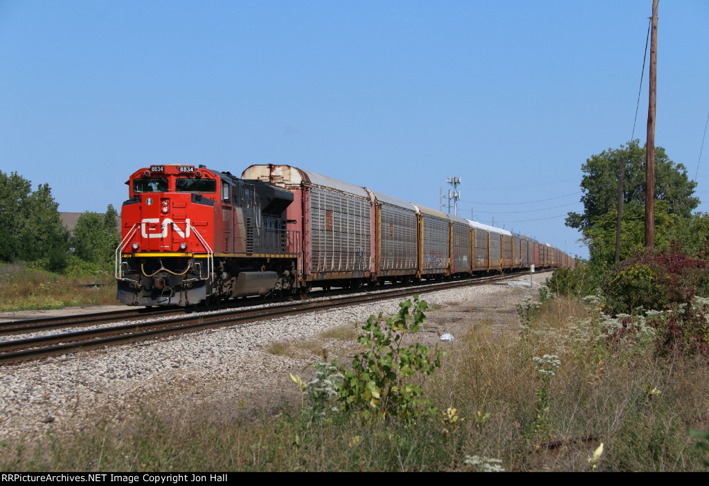 CN 8834 waits to proceed through Milwaukee Junction with E271